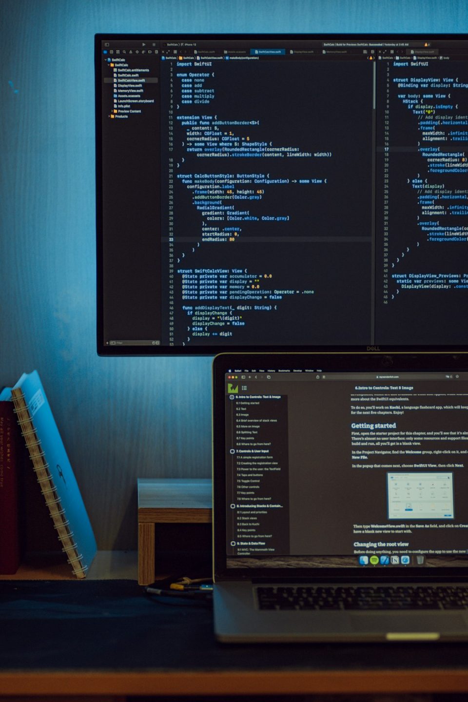 black flat screen computer monitor turned on displaying website code editor screen, developer coding, server terminal window