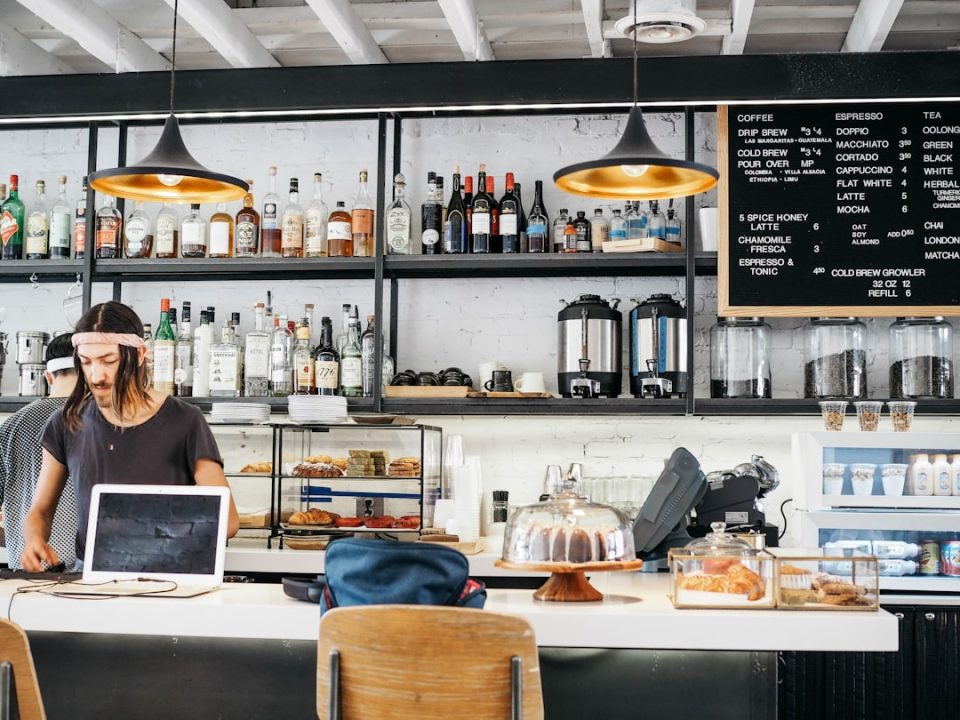 two men standing near white kitchen island coffee shop interior website, modern cafe website design, weebly setup