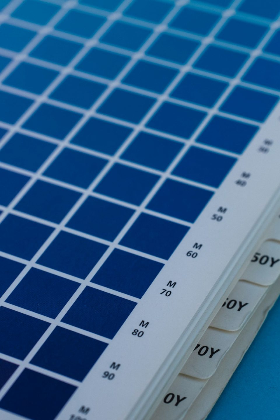 white and blue printer paper color palette selection, branding color wheel, designer choosing colors, creative workspace