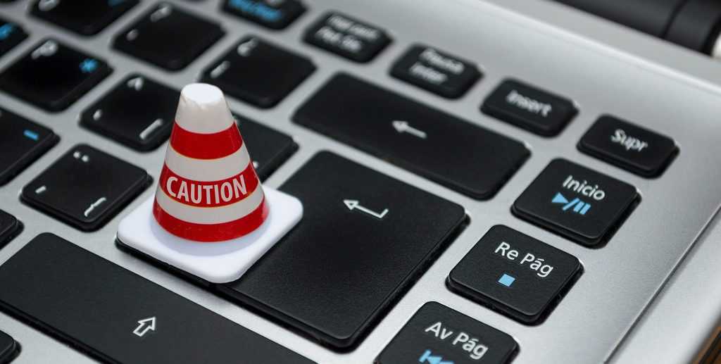Image of caution on keyboard