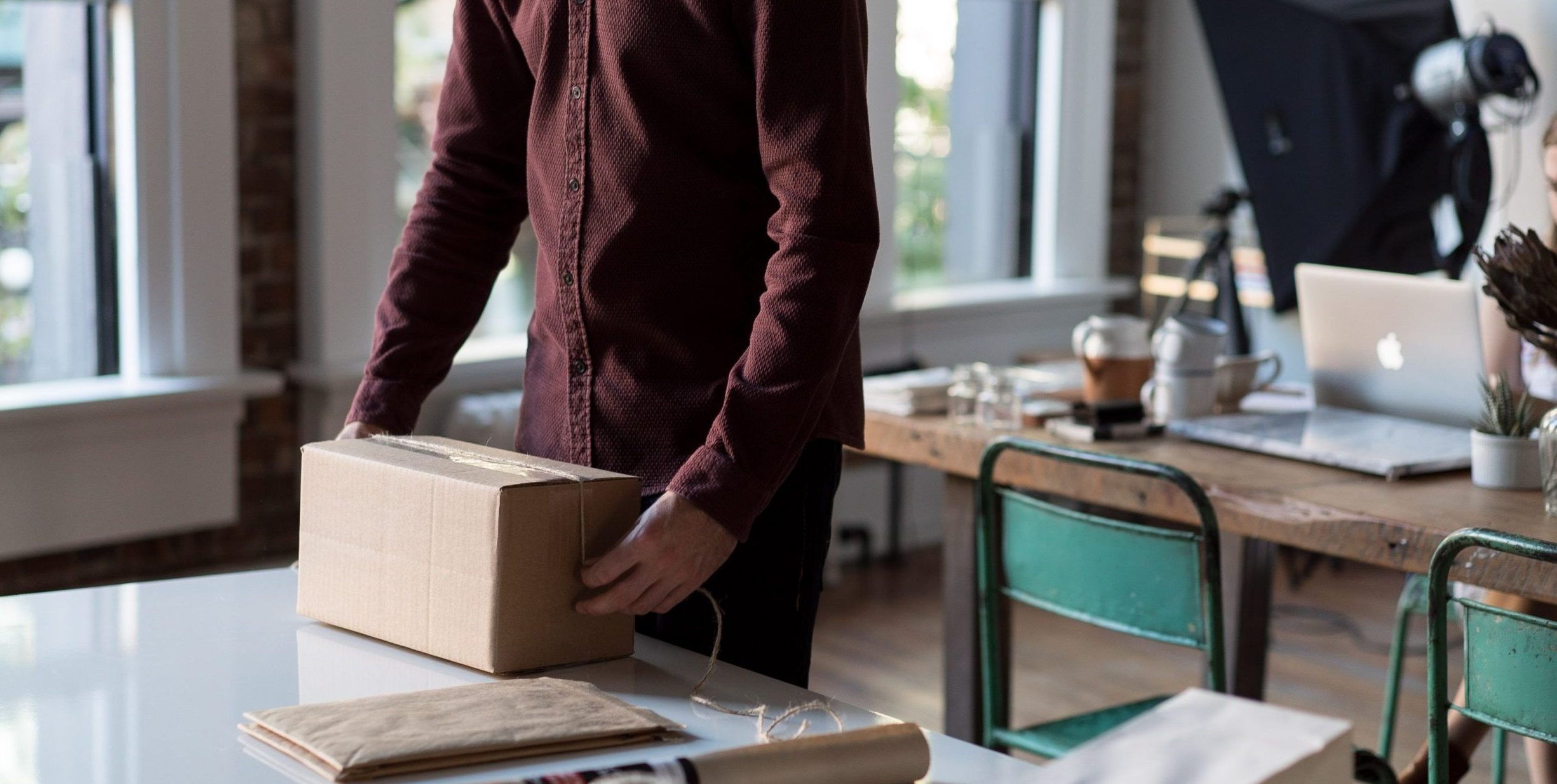 Man wrapping up a package