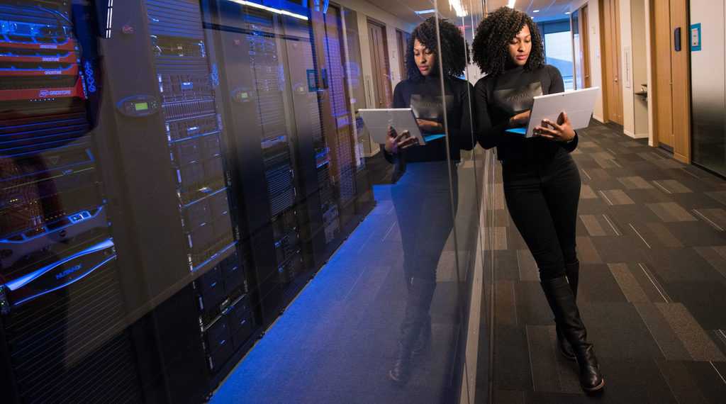 Woman standing next to a server