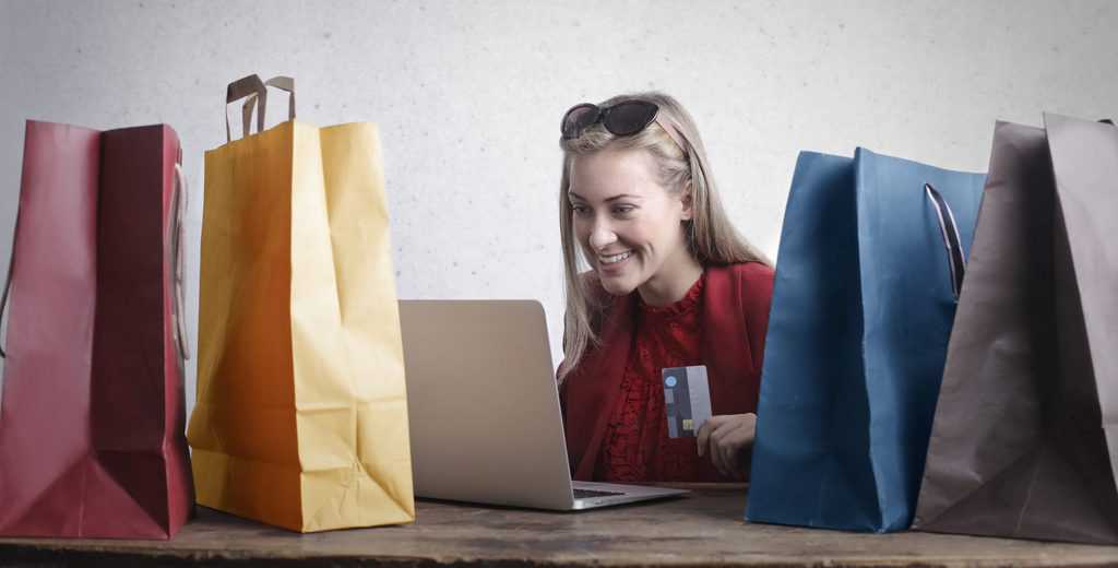 Happy woman shopping online at home