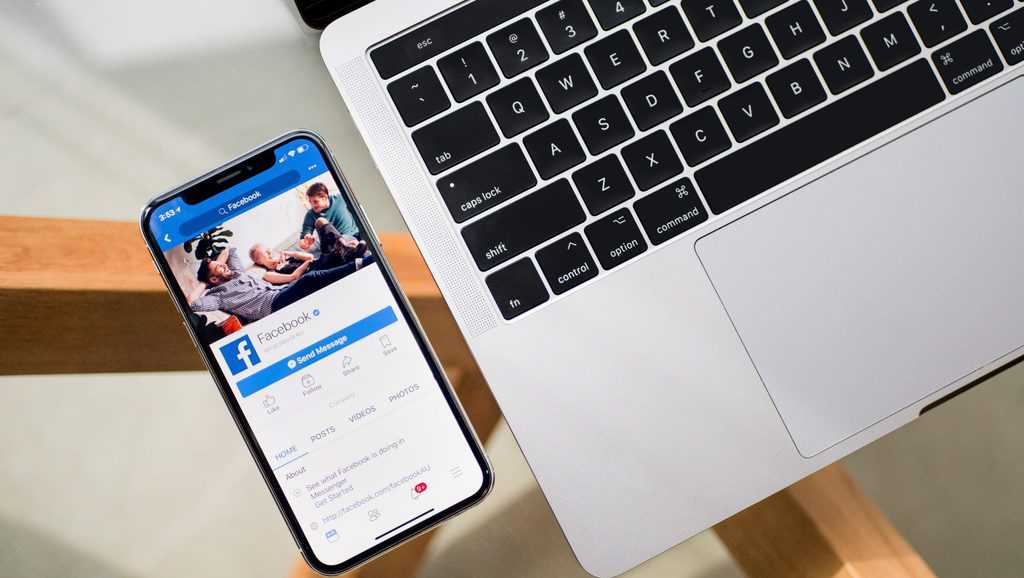 iPhone X beside MacBook