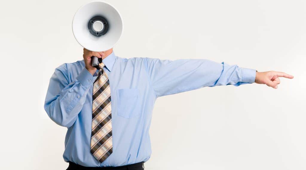 Man with megaphone pointing