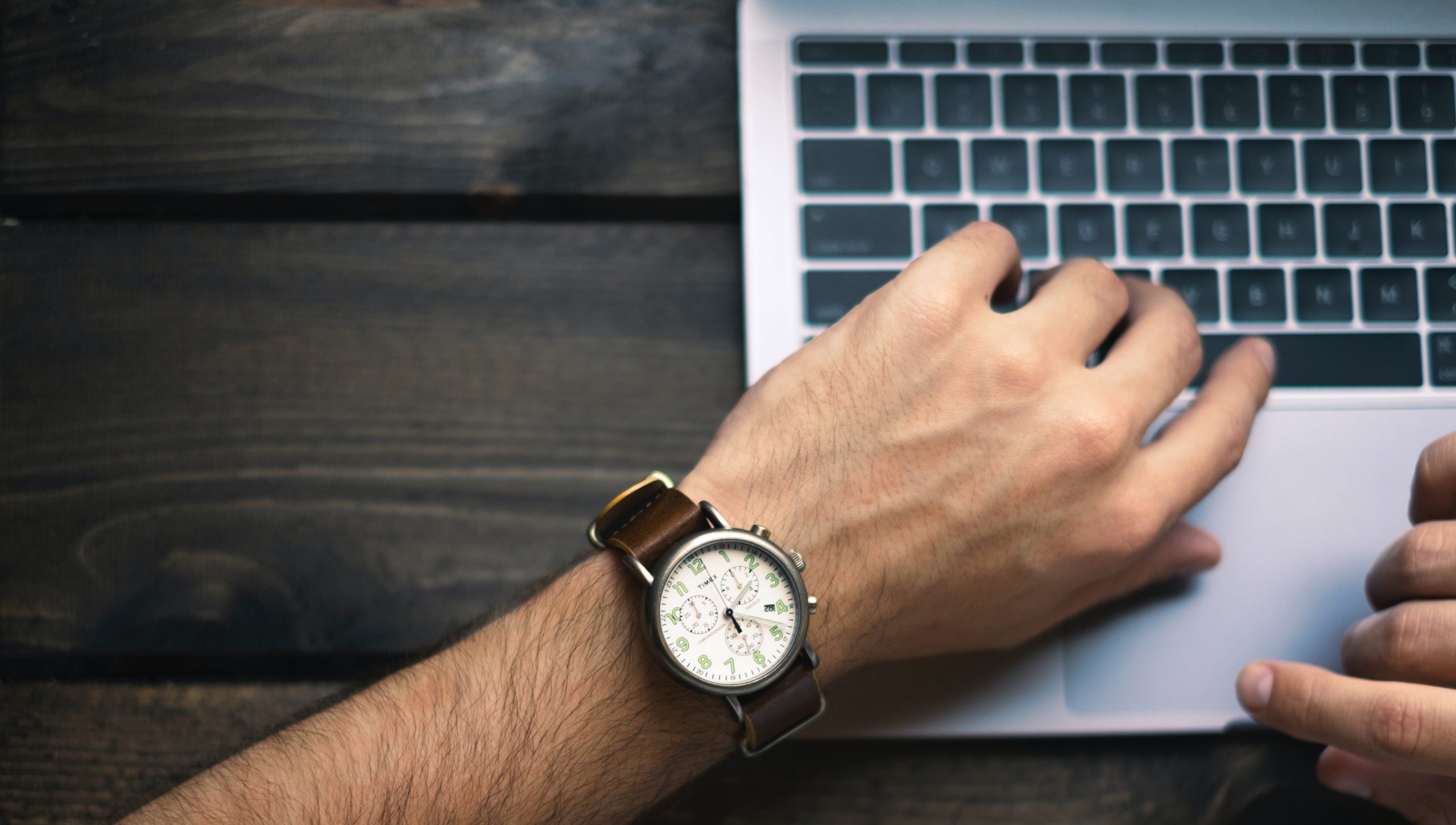 Man in a watch typing