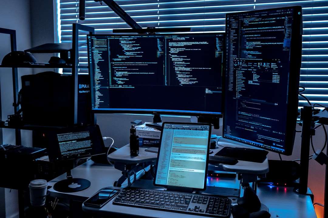 a desk with several monitors cyber security dashboard monitoring traffic, proxy server control panel screen
