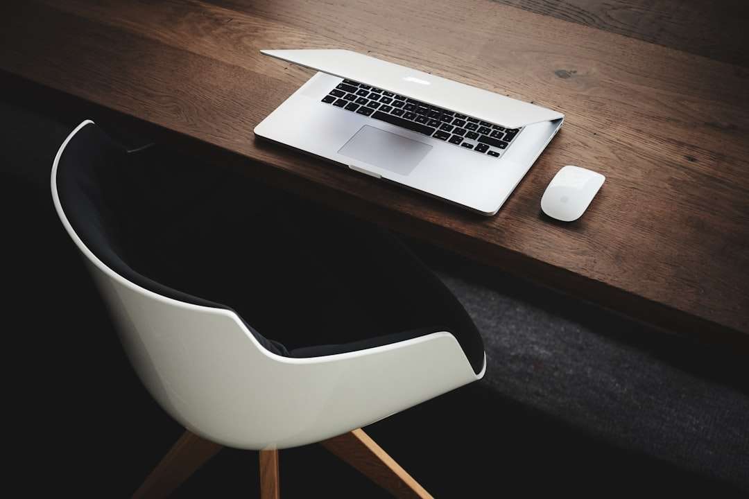 Apple MacBook beside computer mouse on table crm agent, customer service, office communication