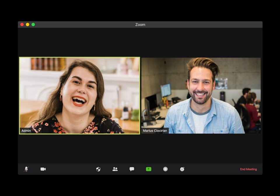 man in blue dress shirt smiling beside woman in black and red floral dress zoom calendar integration interface, business scheduling dashboard, meeting automation workflow