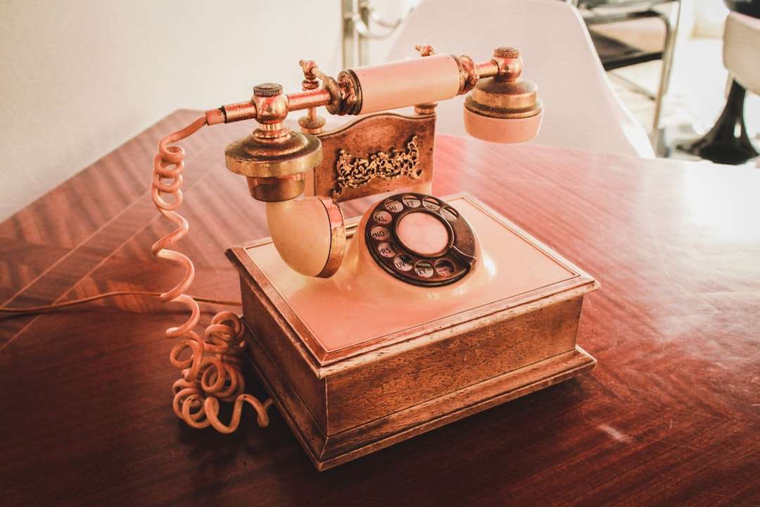 white and brown rotary telephone on brown wooden table motorola phone, meta quest headset, vr streaming