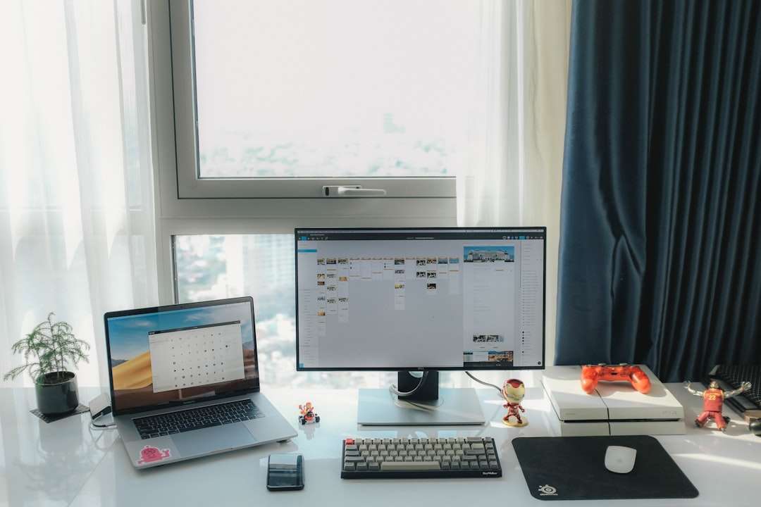 flat screen computer monitor and MacBook Pro near window linkedin dashboard, crm integration, marketing funnel