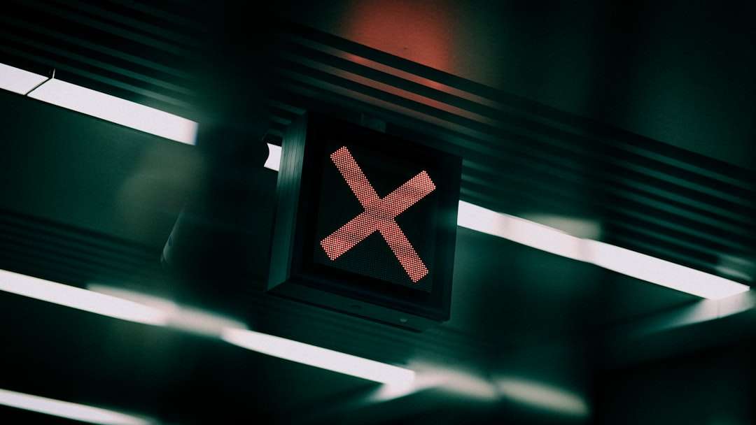 a close up of a traffic light with a red x on it pc gaming crash error screen
