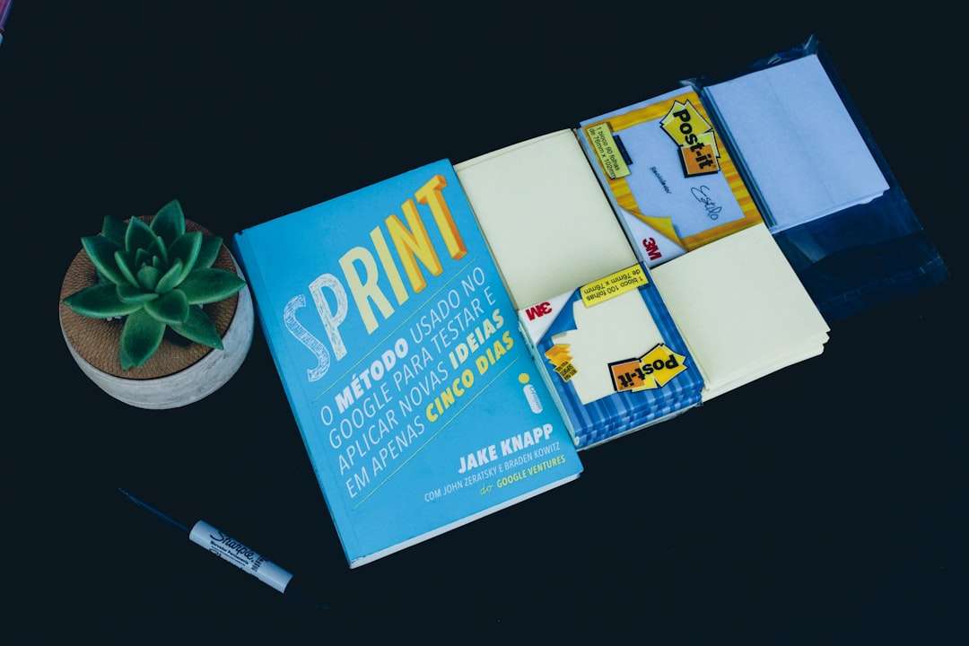 Sprint book and black marker business card printing samples, paper textures, stationery flat lay
