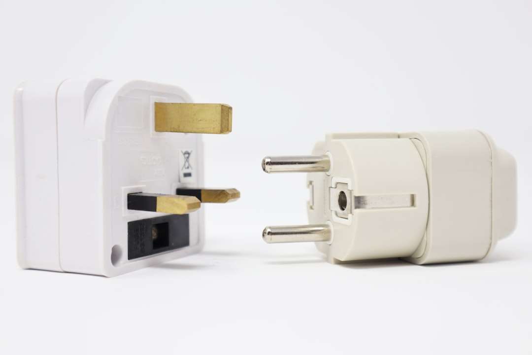 two white power adapters on white background smart plug, home devices, energy control
