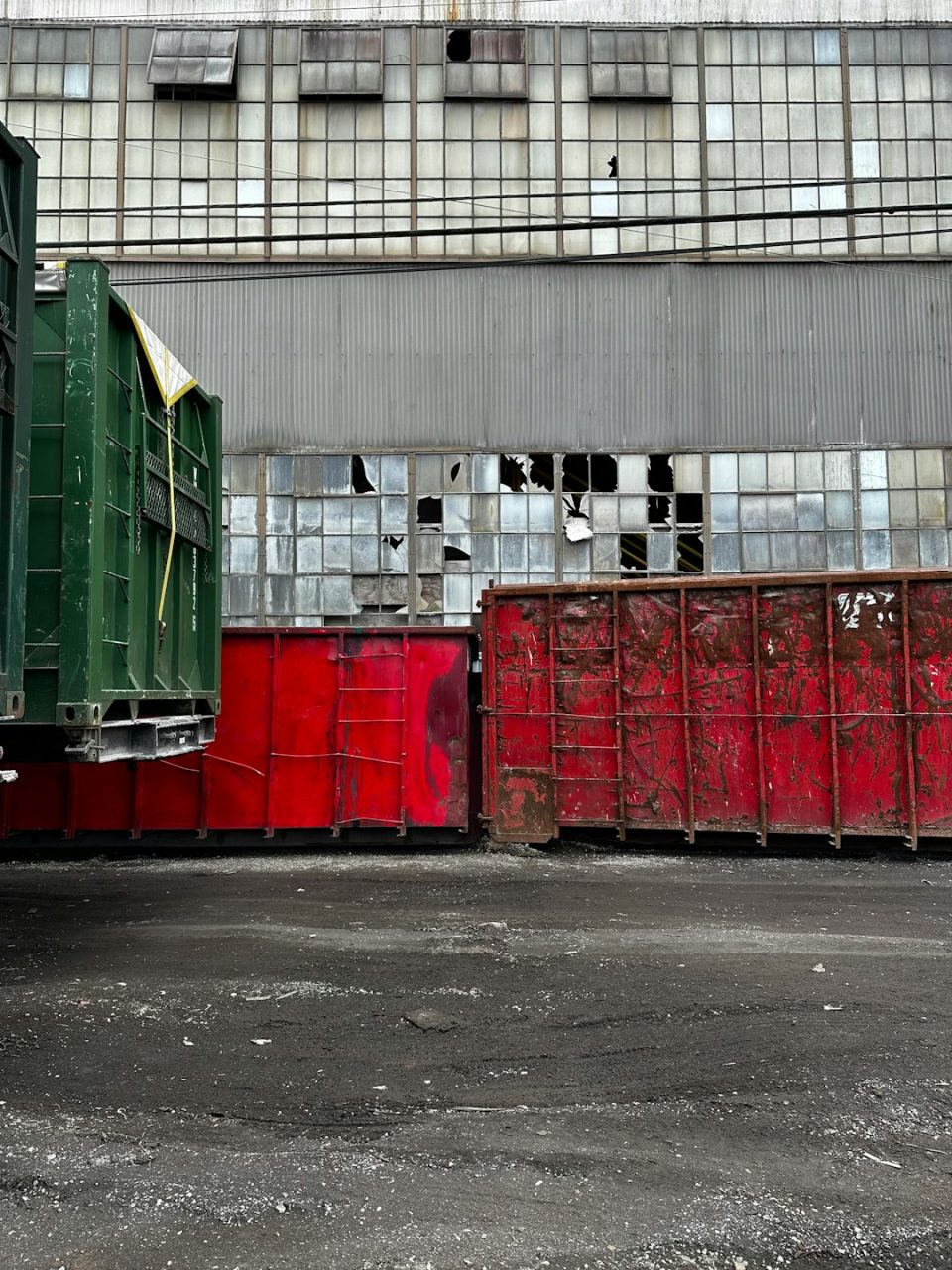 a large truck parked in front of a building freight truck, empty warehouse, logistics shutdown