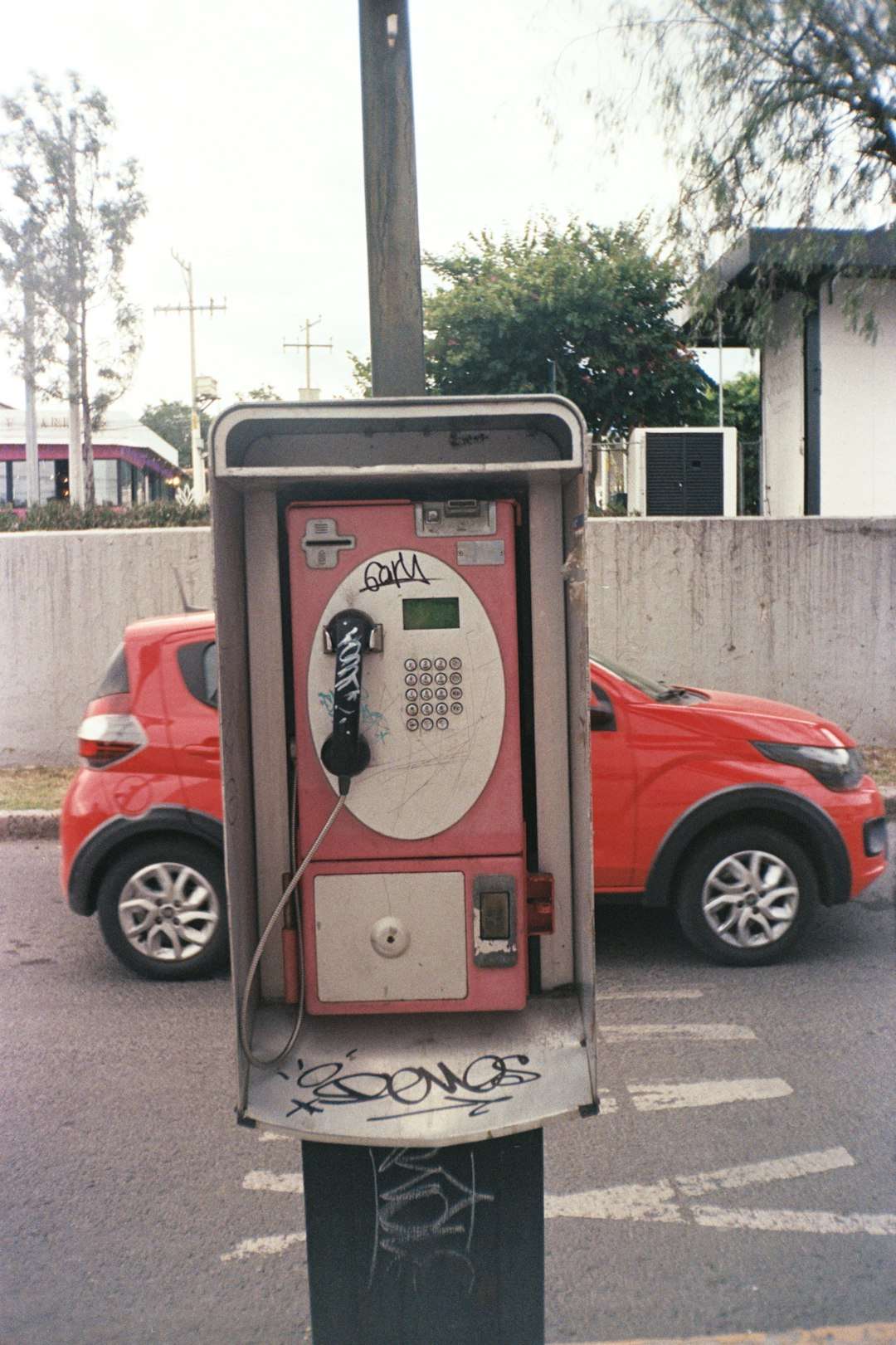 A parking meter sitting on the side of a road qr code phone scan marketing poster