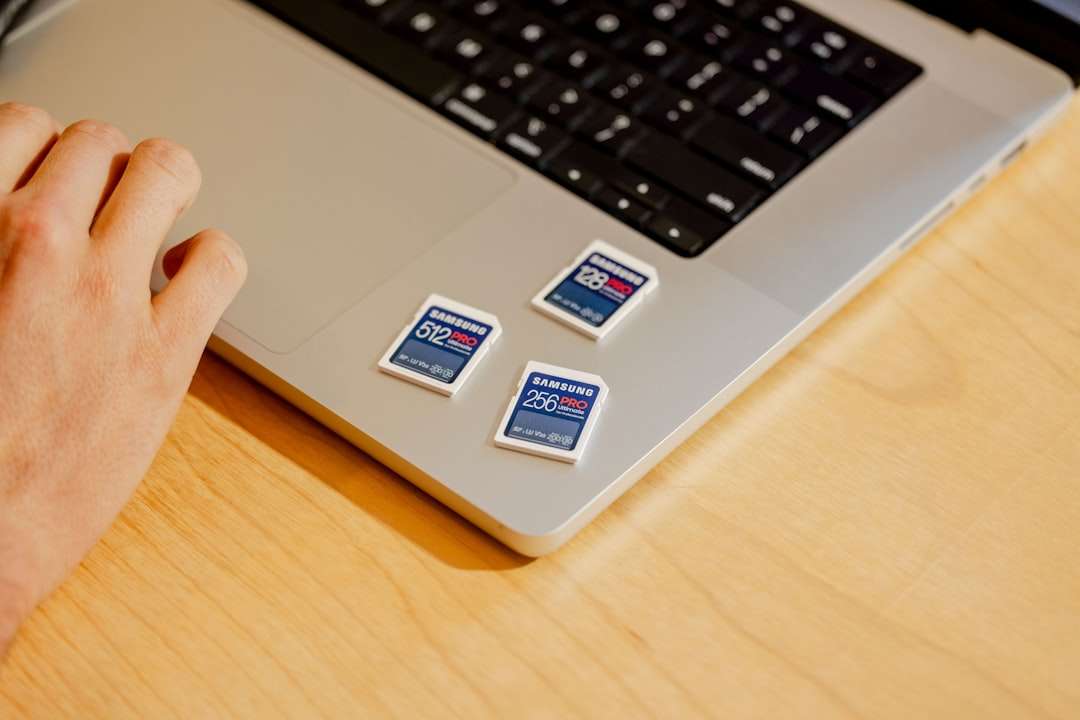 A person sitting at a desk with a laptop business card design template screen laptop modern workspace