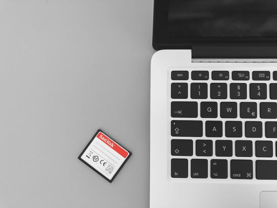 white and red marlboro cigarette pack on macbook pro business card design template screen laptop modern workspace