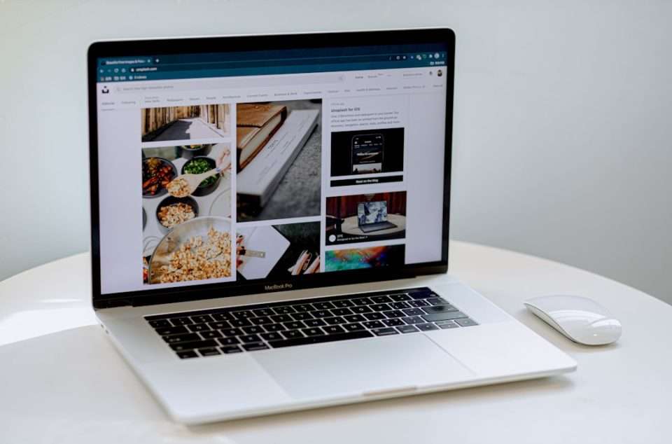 macbook pro on white table minimalist website design, portfolio layout, creative business homepage